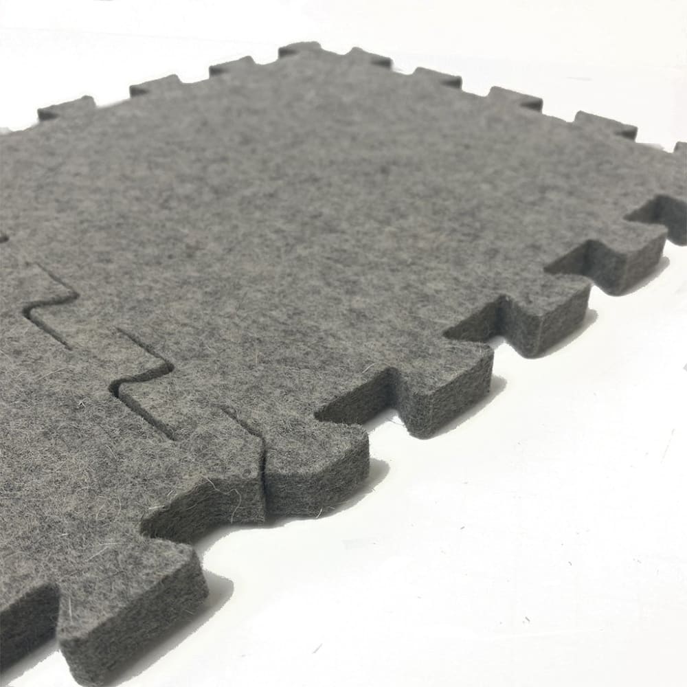 Gray interlocking felt floor tiles from Wool Press n Lock Tiles for design wall use