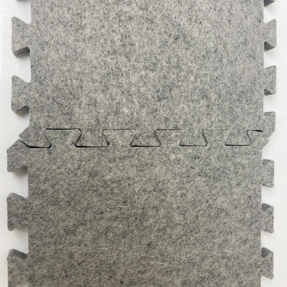 Gray interlocking felt floor tiles from Wool Press n Lock Tiles for design wall use