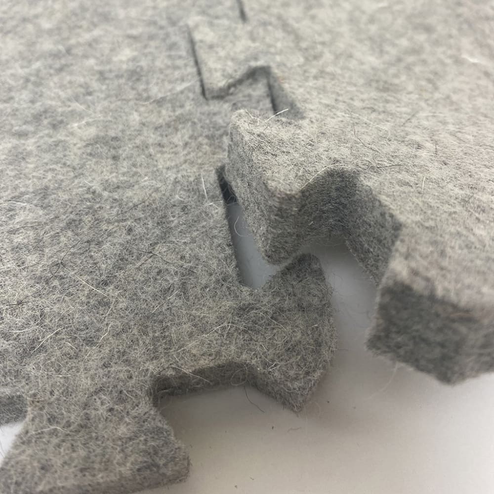 Grey felt interlocking puzzle pieces for Wool Press n Lock Tiles wool pressing mats or design wall