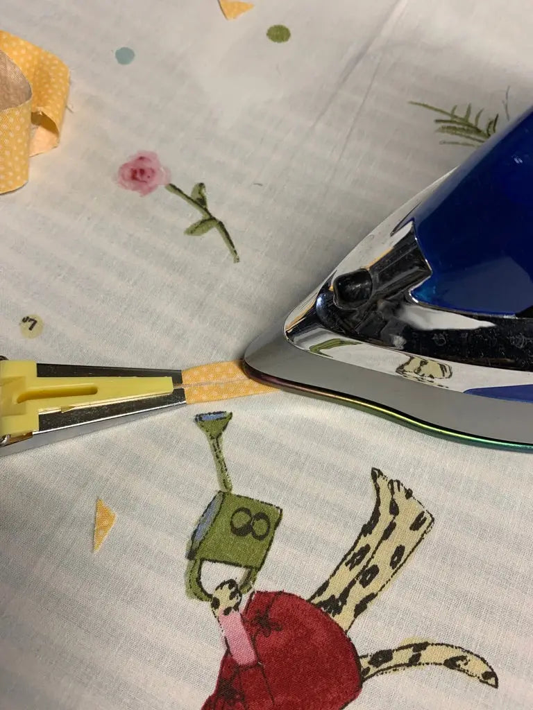 Ironing with bias tape maker