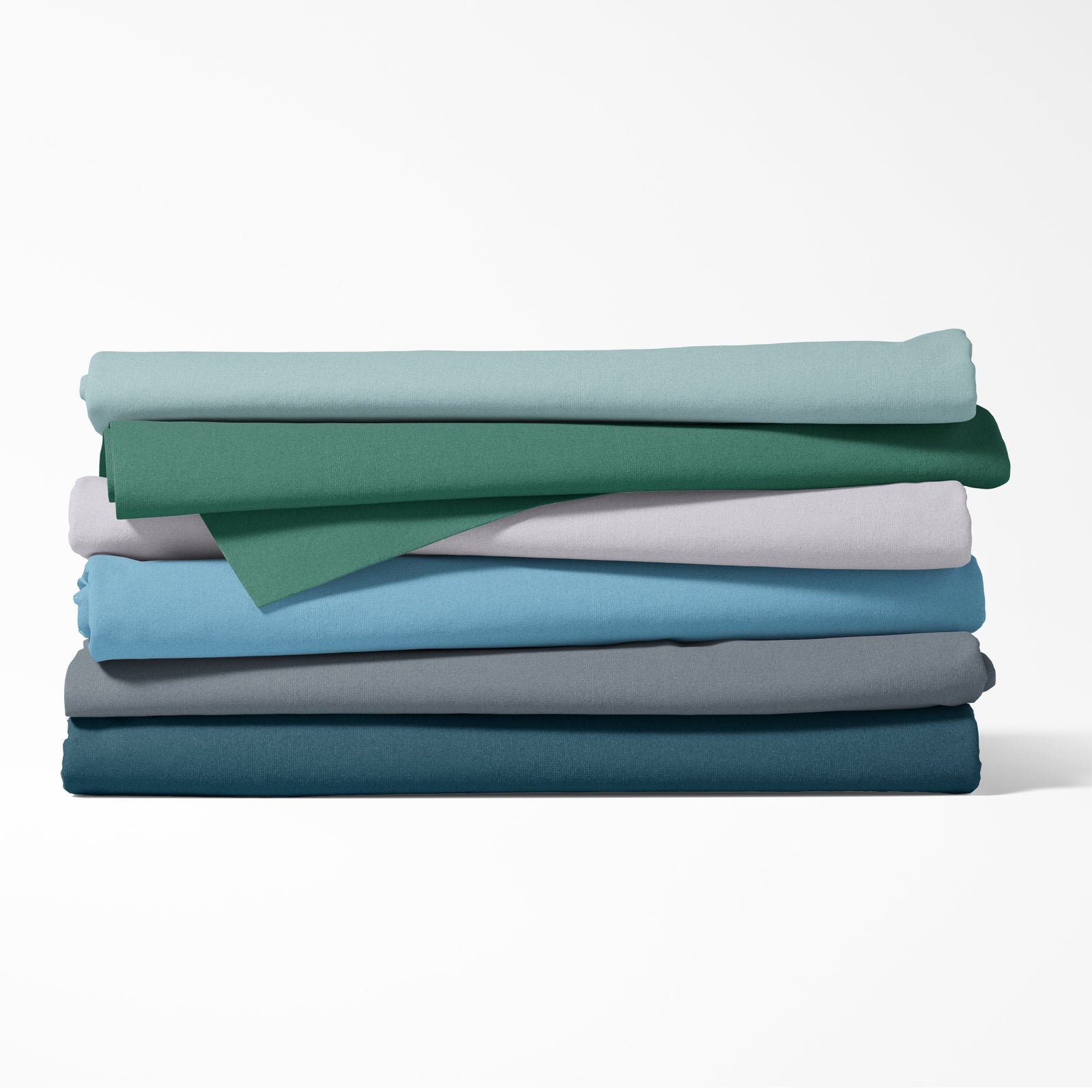 Stack of folded fabric sheets in various colors on a white background