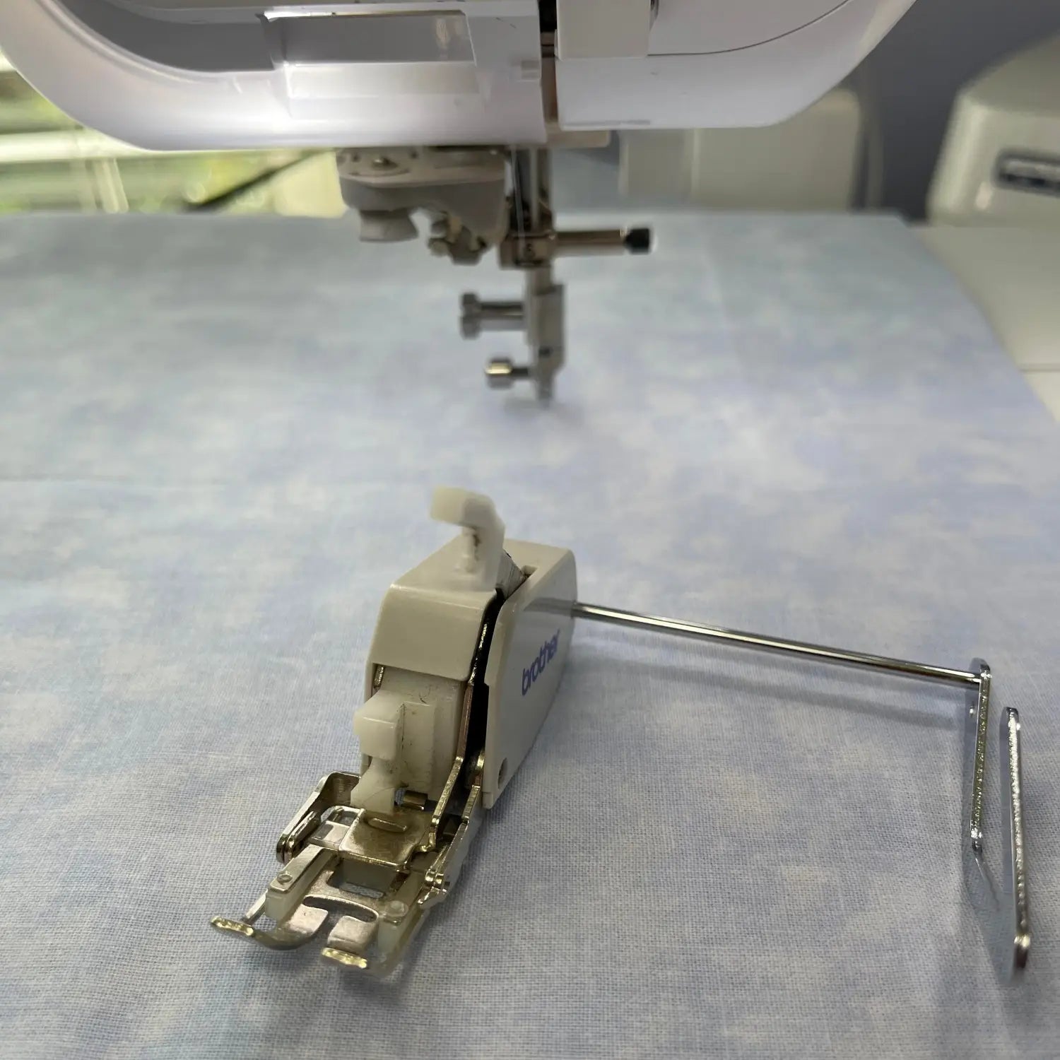 Walking foot with a guide for sewing machine