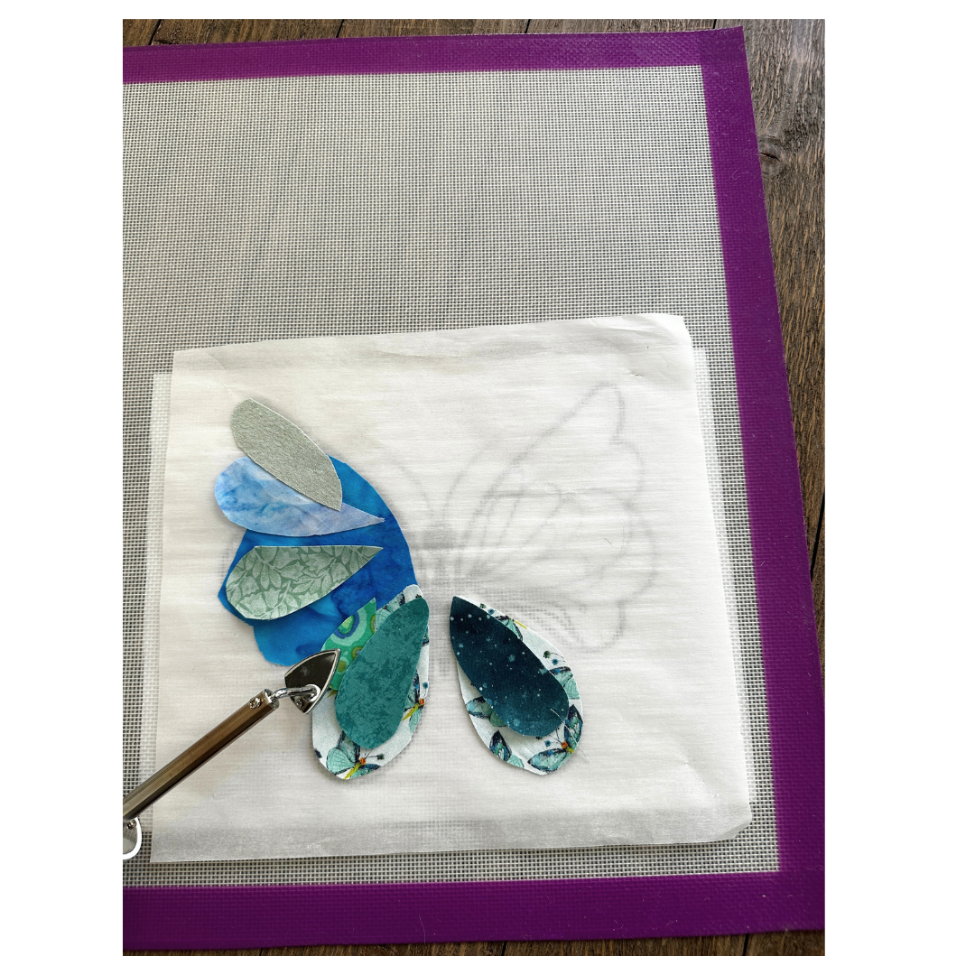 Silicone pressing mat used under wool pressing mats on a tabletop