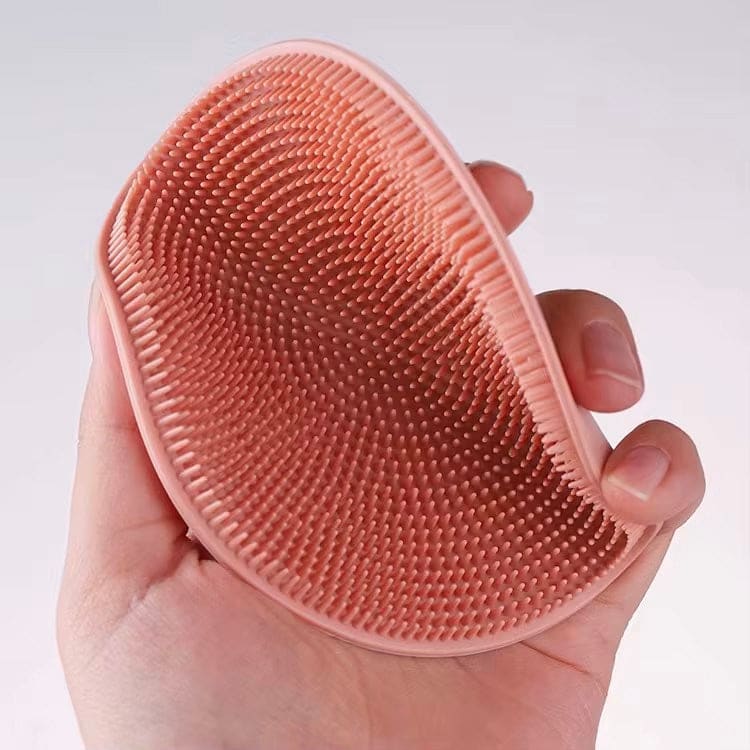 Peach silicone Cutting Mat Scrubber with small nubs, perfect as a handy mat scrubber
