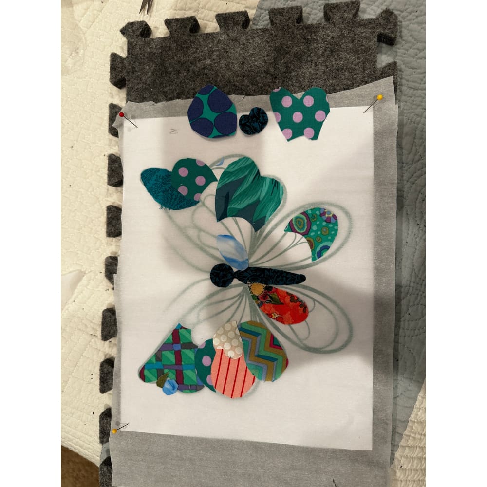 Butterfly applique made with fabric scraps on fusible web for quilting and free motion quilting