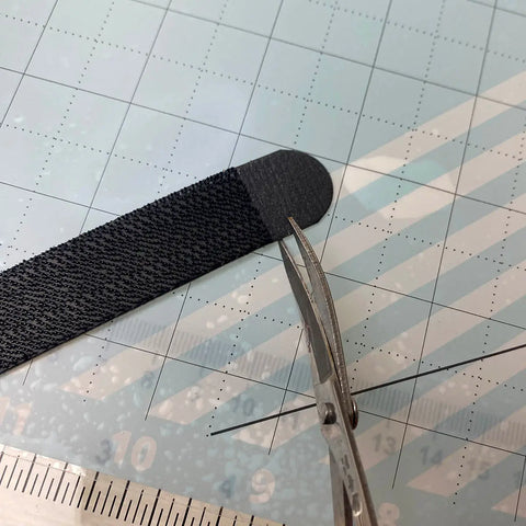 Trim the tail of the command strip