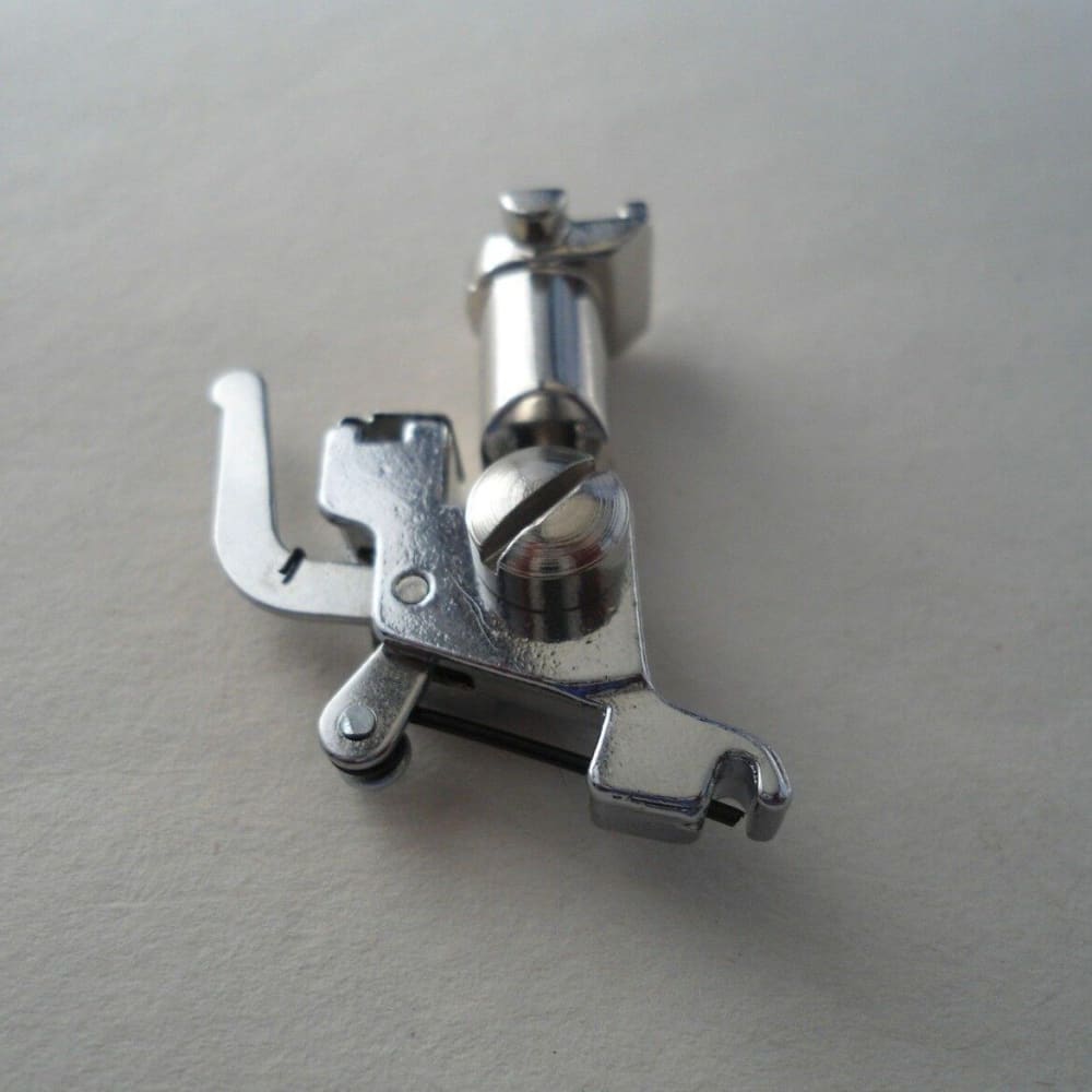 Silver metal Bernina sewing machine presser foot with snap-on shank for easy use