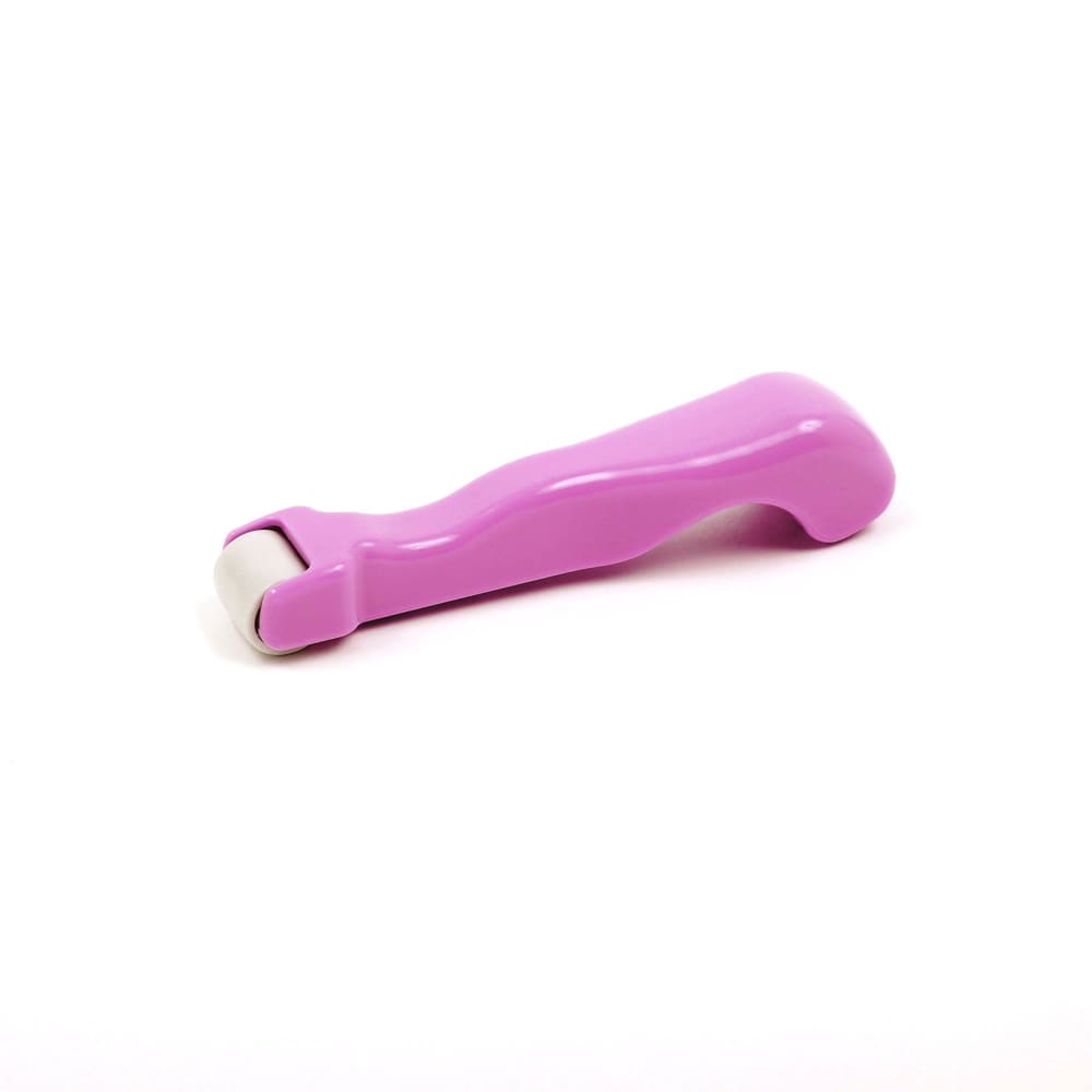 Pink handheld roller massager for press seams, perfect as a press seam roller tool